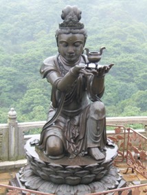 Statue makes offerings to the Buddha  - Lantau island, Hong Kong
